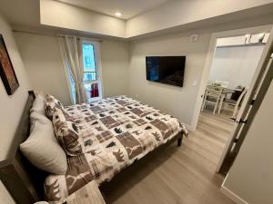 a bedroom with a bed with a quilt on it at Sparrowhawk Mountain Resort in Dead Man's Flats