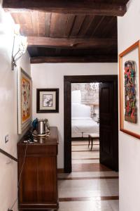 a room with a door leading to a bedroom at La Cantina del Convento in Potenza +7 photos