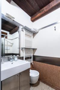 a bathroom with a white sink and a toilet at La Cantina del Convento in Potenza
