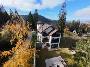 an aerial view of a house in the woods at Star Hill Apartments in Nova Varoš