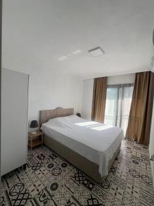 a bedroom with a large bed in a room at Maia Suites in Çeşme