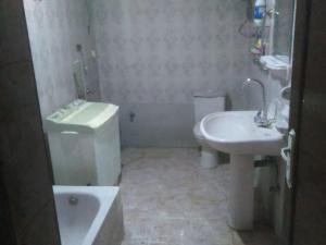 a bathroom with a sink and a toilet and a sink at Tetas Villa in Naj‘ al Maḩaţţah