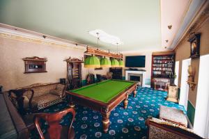 a living room with a pool table in it at Traditional Log Cabin next to Harry Potter Studios in Kings Langley