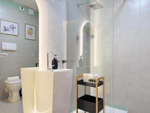 a bathroom with a sink and a shower with a toilet at Luxury Studio con Private Jacuzzi, Spa Experience in Perugia