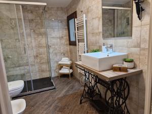 a bathroom with a sink and a shower at Principe Giardinelli in Piazza Armerina +78 photos