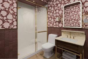 a bathroom with a toilet and a shower and a sink at The Queen’s Cue, Stratford, A Tribute Portfolio Hotel in Stratford