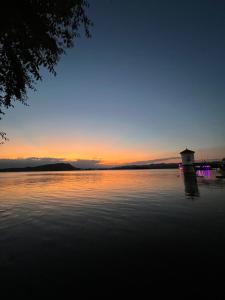 a view of a body of water at sunset at Departamentos La Morita in Embalse