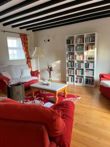 a living room with a red couch and a table at Time Out Accommodation in Cahersiveen