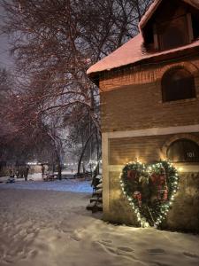 a heart painted on the side of a building with lights at Cross Over Zemun in Belgrade