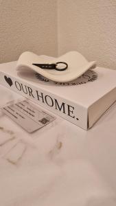 a pair of scissors sitting on top of a book at Lian am See in Friedrichshafen +20 photos