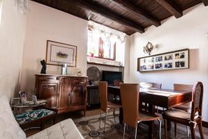 a dining room with a table and a fireplace at B&B Al Convento in Potenza