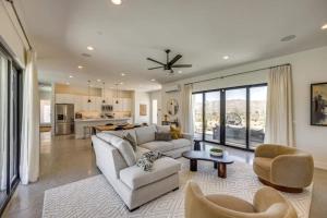 a living room with a couch and a table at Luxury Desert Villa with Pool and Spa in Yucca Valley