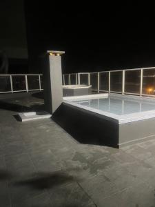 a swimming pool on top of a building at night at Edificio lillion 2 in Mar del Plata
