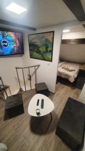a living room with a white table and chairs at U Studánky in Drnovec