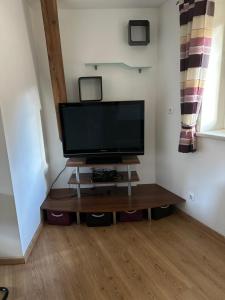 a flat screen tv sitting on top of a wooden table at Apartment Obervellach in Obervellach