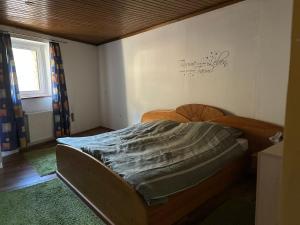 a small bedroom with a bed in the corner at Apartment Obervellach in Obervellach