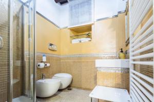 a bathroom with a toilet and a sink at B&B Al Convento in Potenza +28 photos