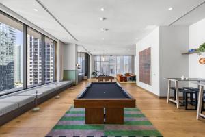 a living room with a pool table in it at Prime Location Studio Steps from Top Attractions in Miami