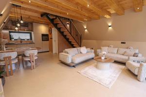 a living room with a couch and a table at "Vista Frame" JAZ - lake view in Višegrad