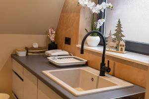a kitchen sink with a faucet next to a counter at "Vista Frame" JAZ - lake view in Višegrad
