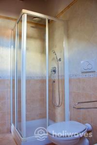 a shower with a glass door in a bathroom at Appartamento Ad Navalia in Varazze +14 photos