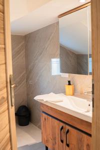 a bathroom with a sink and a mirror at Domaine de la batelle in Arles +28 photos