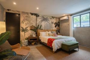 a bedroom with a bed and a large window at Flor De India in San Juan