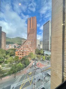 a view of a city with tall buildings at Mitik Vista iluminación y comodida in Bogotá