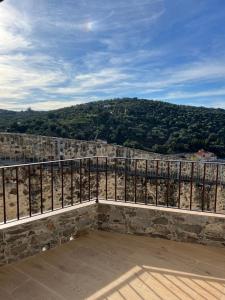 a balcony with a view of a mountain at Villa Marín in Aroche