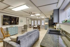 a large living room with a couch and a kitchen at Private Boat Launch! Riverfront Jefferson Retreat in Jefferson