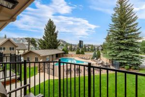 a view from the balcony of a home with a swimming pool at Quality Inn near Rocky Mountain National Park in Estes Park