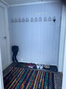 a room with a group of shoes on the floor at Lite hus i Vestre Slidre in Vollen