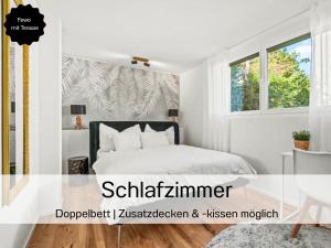 a white bedroom with a bed and a window at Ferienhausträume - ebenerdiges Bodensee Apartment mit Garten und großer Terrasse mit Grill in Kreuzlingen