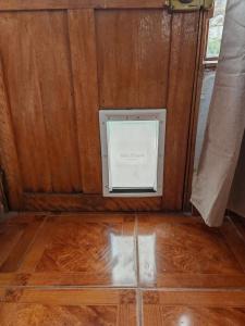 a box in the corner of a room with a wooden floor at UMAY lodge house in Urubamba