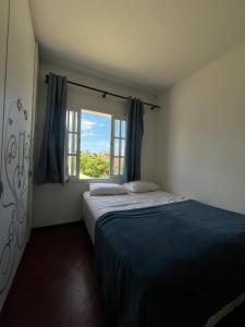 a bedroom with a large bed and a window at BC Bier Hostel in Balneário Camboriú +15 photos