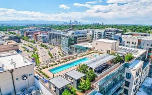 an aerial view of a city with a pool at Cherry Creek Rooftop Oasis in Denver
