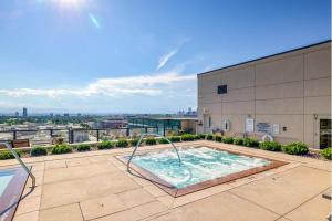 a swimming pool on the roof of a building at Cherry Creek Rooftop Oasis in Denver