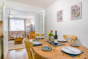 a dining room and living room with a wooden table and chairs at 2 Bed in Peterstow oc-w33537 in Peterstow