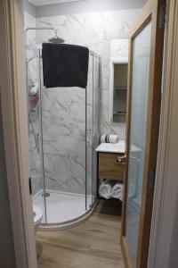 a bathroom with a shower and a sink at The Fairways, CastleBlayney in Castleblayney +22 photos