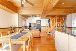 a kitchen and dining room with a table and chairs at Hakuba Powder Cottage in Hakuba