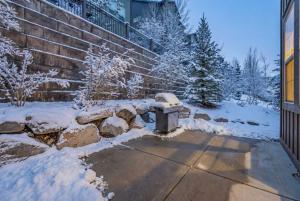 a fire hydrant covered in snow next to a building at Charming 3BR-Near Skiing & Hiking in Kamas