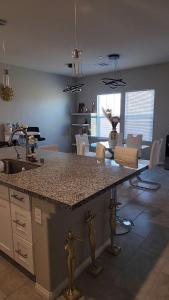 a kitchen with a granite counter top in a room at Furnished Private Room in Las Vegas