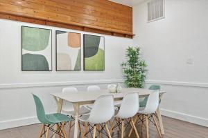 a dining room with a white table and chairs at Gorgeous 4BR Home with Huge Yard Pool in Denton