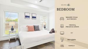 a white bedroom with a bed and a window at Gorgeous 4BR Home with Huge Yard Pool in Denton