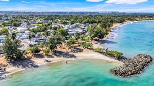 an aerial view of a beach with a resort at Aquaville Dorado Moderna Villa 2 in Dorado