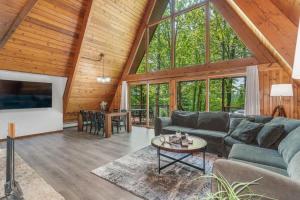 a living room with a couch and a table at Tamarack Lodge Tomahawk WI in Lake Tomahawk