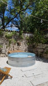 a large hot tub in the middle of a patio at Mas Labrugade in Lebreil
