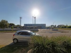 a car parked in a parking lot in front of a building at Bismark Studio in Marcos Juárez