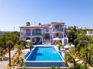 an aerial view of a villa with a swimming pool at Private Bedroom in a Luxurious Villa, Budens in Budens