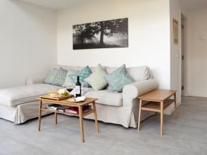 a living room with a couch and a table at Rowanlea in Muthill